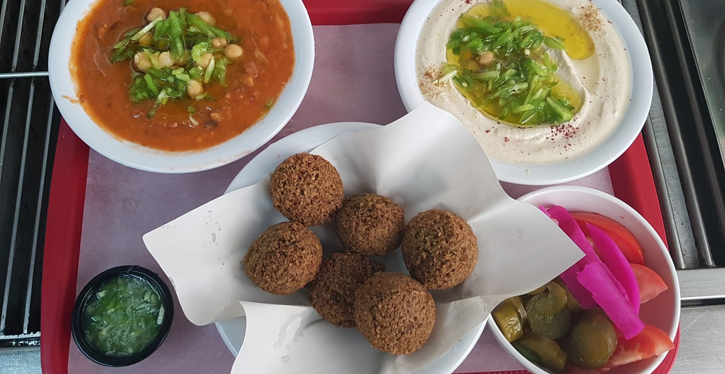 A frying pan of your choice + large hummus + large fava beans + 6 falafel pieces + pickles + 6 cups of bread
