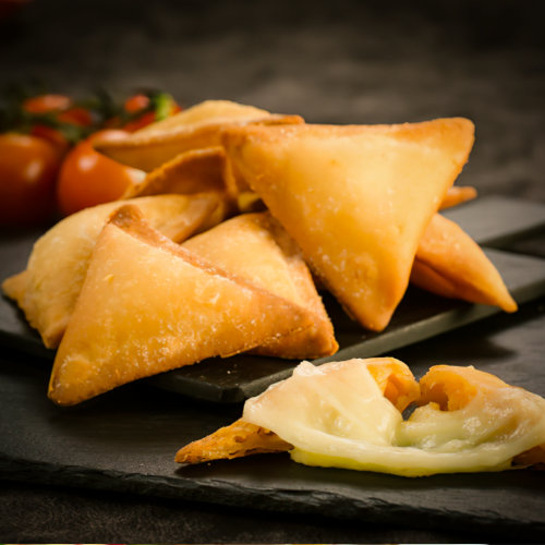 A piece of cheese samosa
