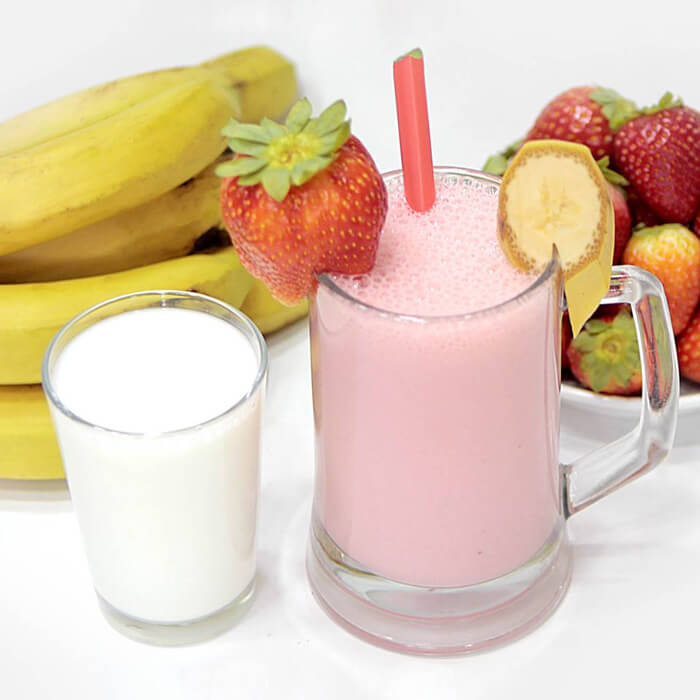 Cocktail with banana, milk and strawberries